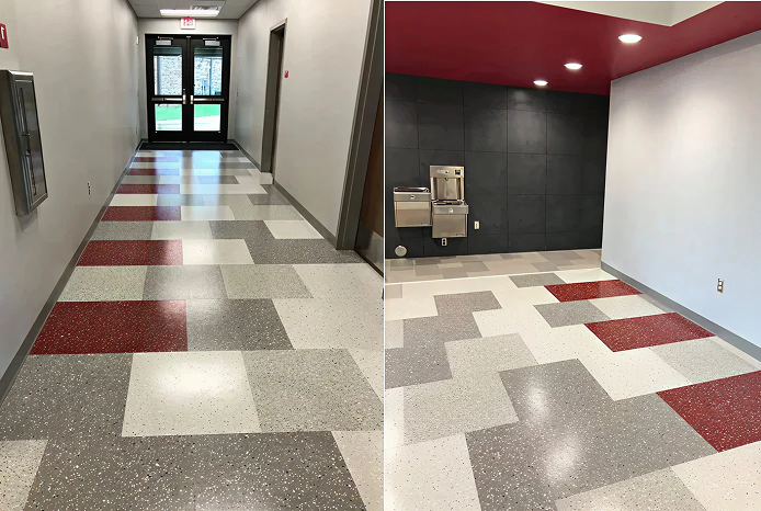 Colorful tiled hallway with water fountain.