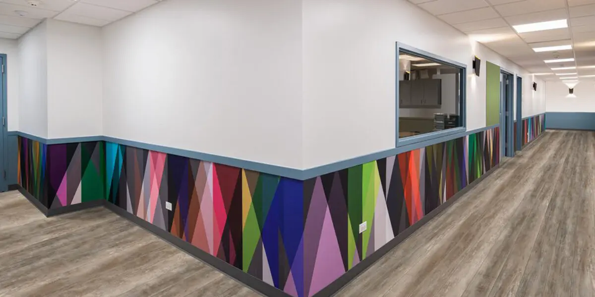 Colorful geometric wall design in hallway