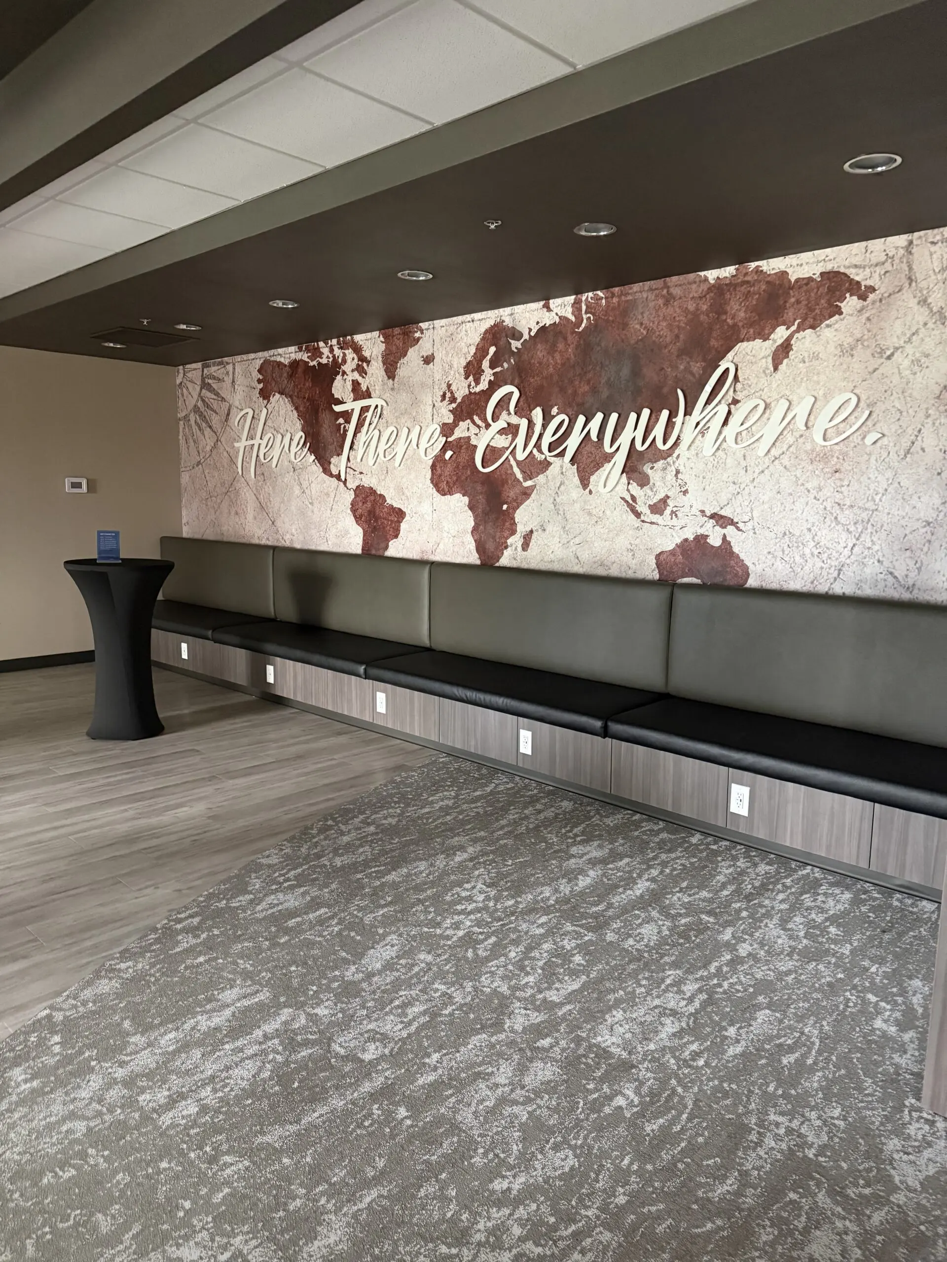 Modern lobby with world map artwork