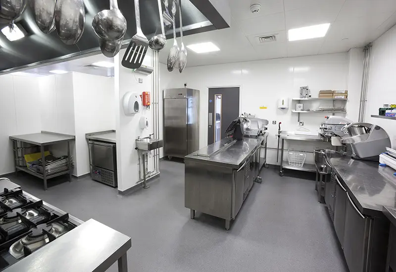 Commercial kitchen with stainless steel equipment